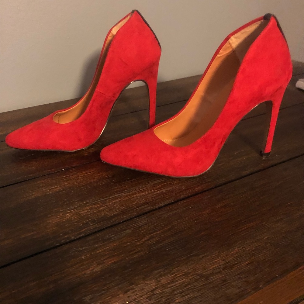 Red heels with black heel stripe